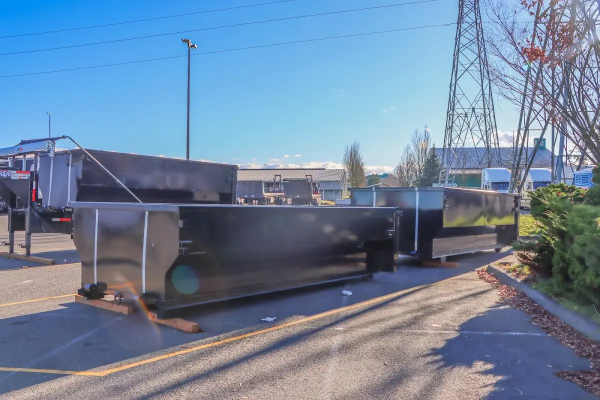 Roll-off dumpster ready for waste disposal at job site for 3 Yard Dumpster Rental in Warren